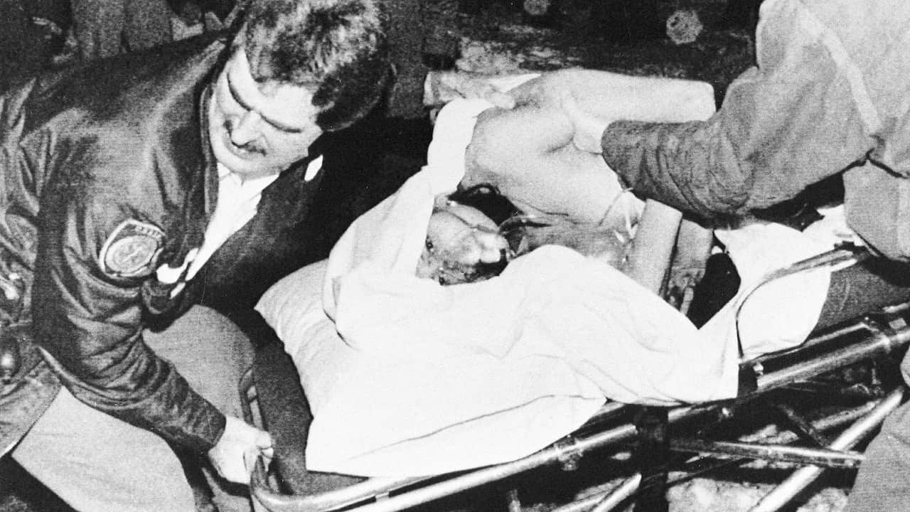 A group of mourners console each other as they cry in front of a victim's casket at the University of Montreal, Dec. 10, 1989. People paid their respects to eight for the fourteen women killed at the school in Wednesday's massacre.