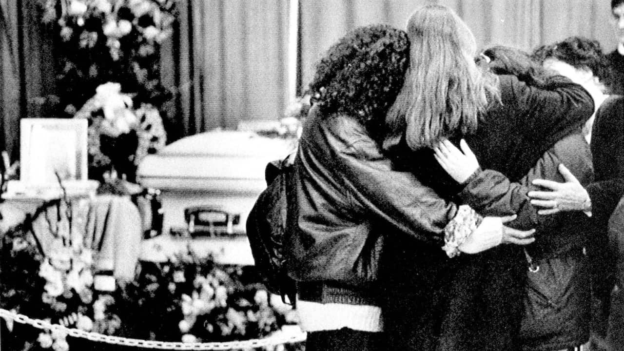 An injured student is taken by ambulance attendants at the University of Montreal, Dec. 6, 1989, where a gunman killed at least 11 people and wounded many others. Witnesses said the gunman roamed the halls, a computer room, the cafeteria, and a classroom,