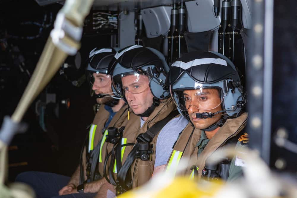 Lieutenant Commander Roneell Chandra (R) onboard HMAS Choules' MRH-90 Maritime Support Helicopter, during a medical evacuation.