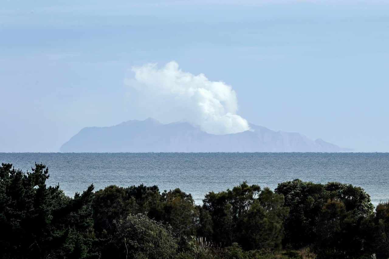 Plumes of steam rise above White Island off the coast of Whakatane, New Zealand, Wednesday, Dec. 11, 2019. 