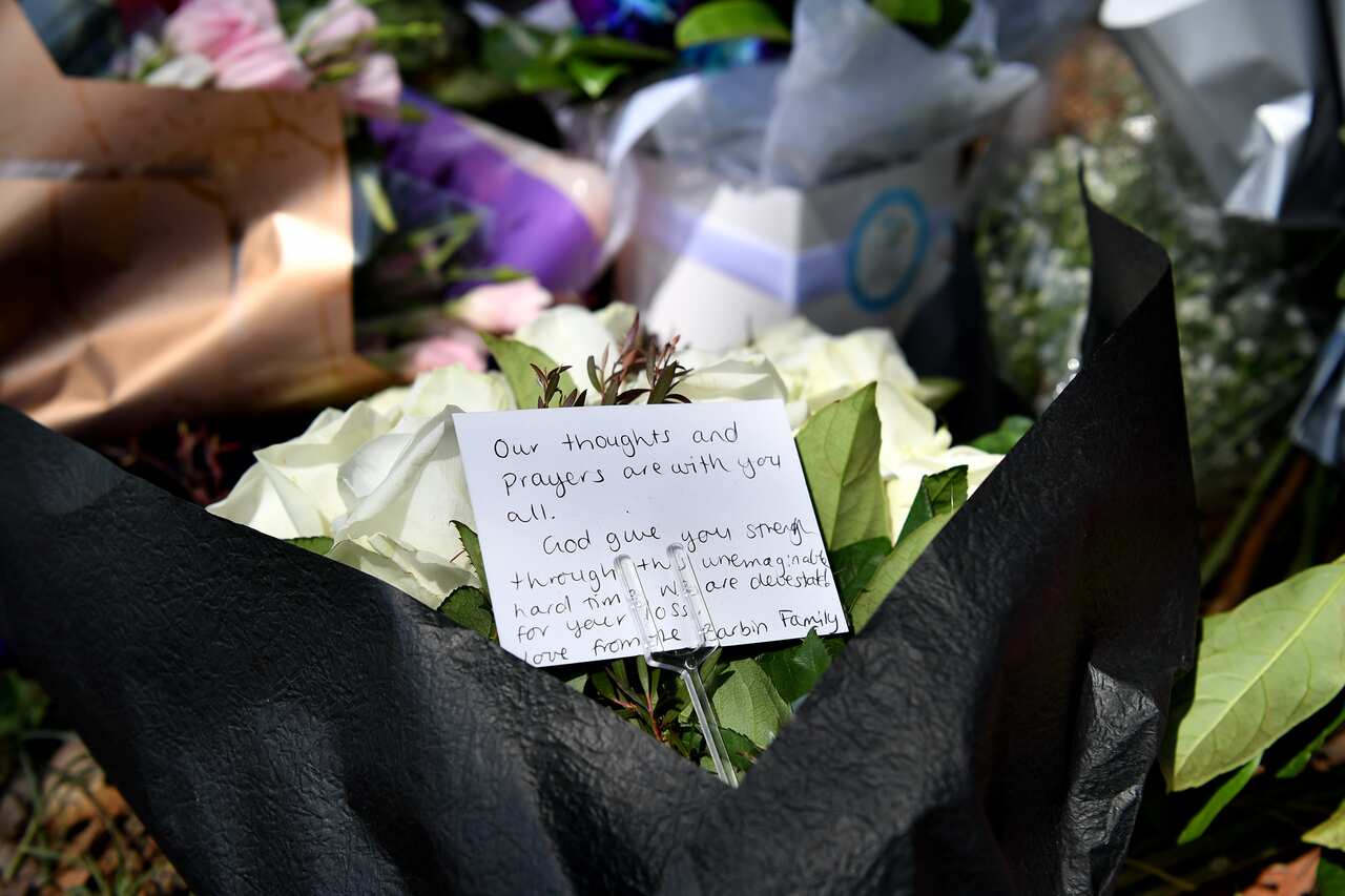 Flowers placed at the scene where seven children where hit on a footpath by a four-wheel drive in the Sydney suburb of Oatlands, Sunday, February 2, 2020. Four children have died and a fifth is in a critical condition after they were hit by a four-wheel d