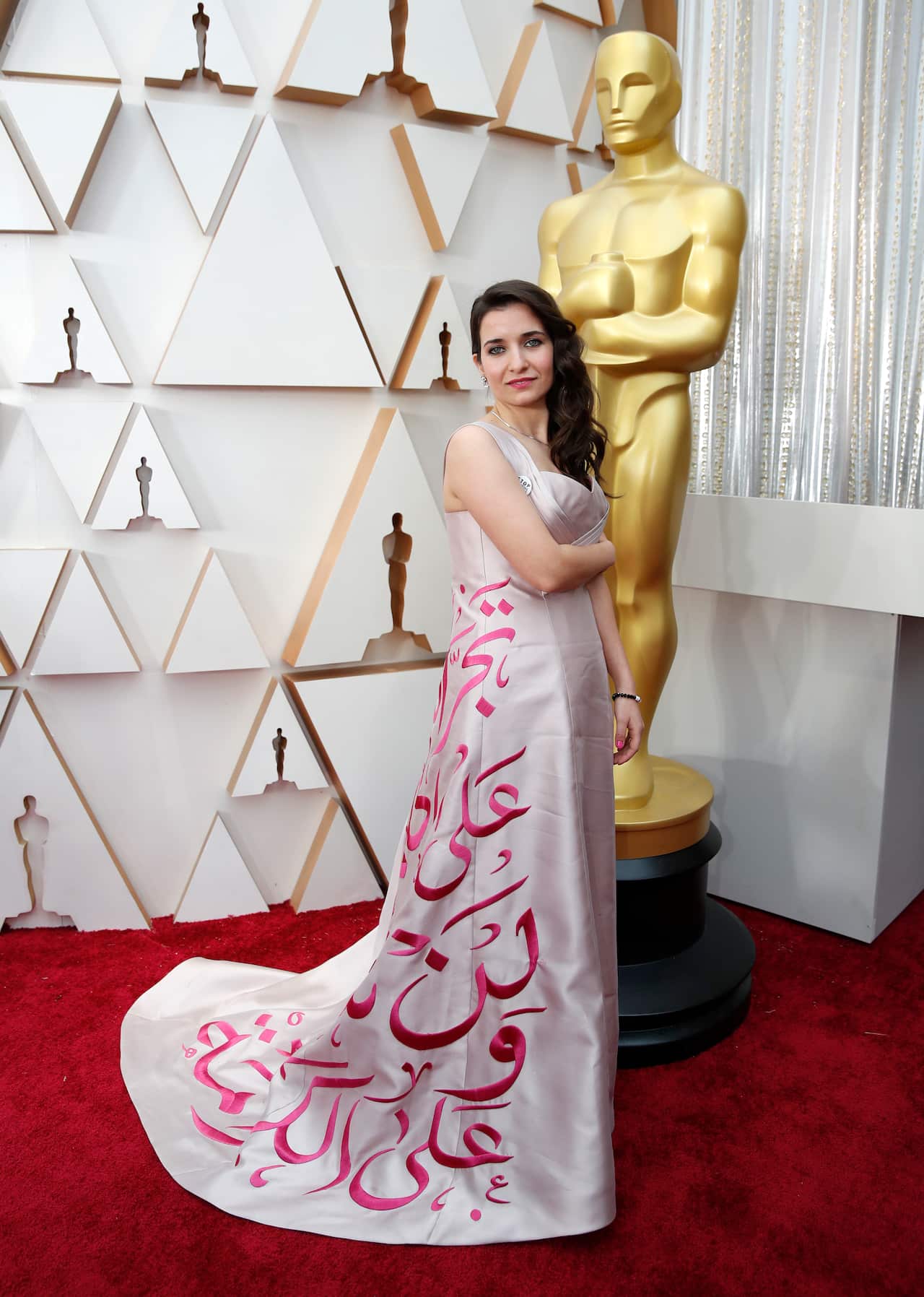 Waad Al-Kateab arrives at the Oscars on Sunday, Feb. 9, 2020, at the Dolby Theatre in Los Angeles. (AP Photo/John Locher)
