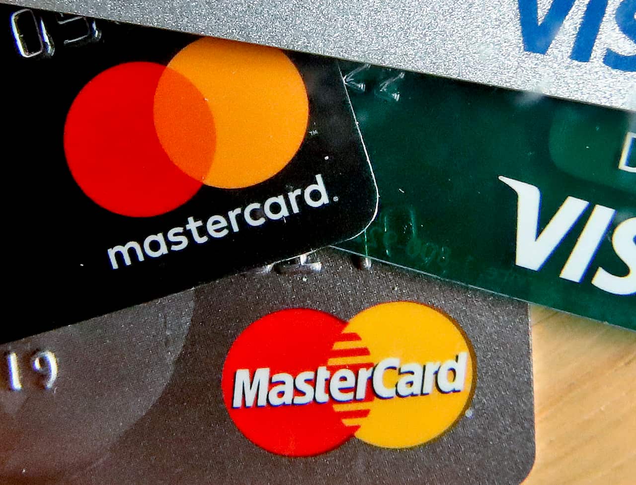 This Wednesday, Feb. 20, 2019, photo shows logos for credit cards in Zelienople, Pa. On Thursday, March 7, the Federal Reserve releases its January report on consumer borrowing.