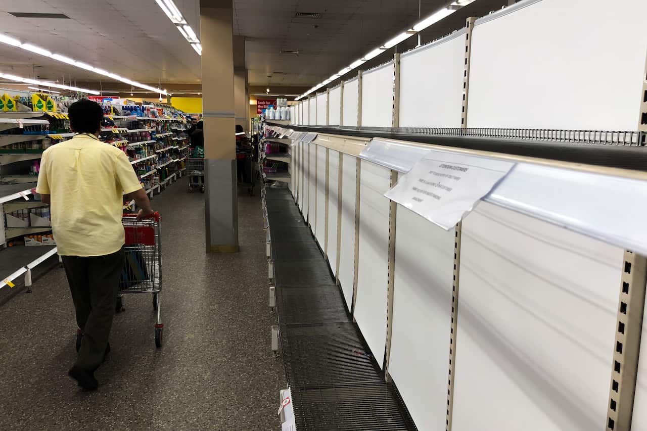 Empty toilet paper shelves are seen at a shopping centre in Sydney, Wednesday, March 4, 2020.