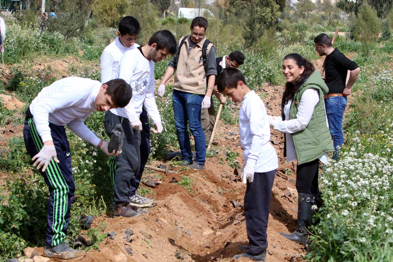 Syrians plant trees in Douma City in the countryside of Damascus, Syria, 05 March 2020.  
