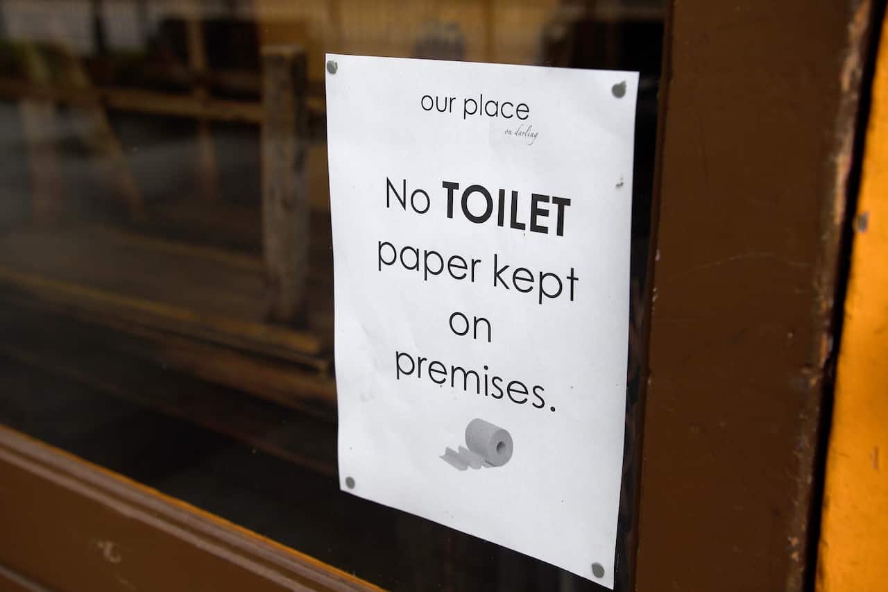 Signage is seen on the entry of Our Place cafe in Balmain Woolworths, Sydney, Saturday, March 7, 2020. Australians are stockpiling toilet paper over Coronavirus fears. (AAP Image/Bianca De Marchi) NO ARCHIVING