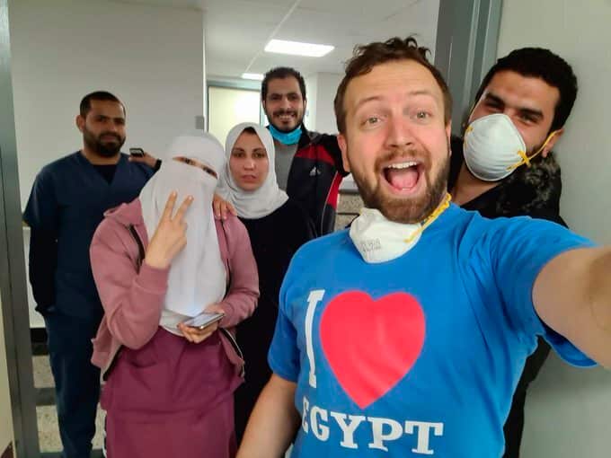 Matt Swider celebrates when his lab results for the new coronavirus came back negative, in Luxor Egypt, Egypt.