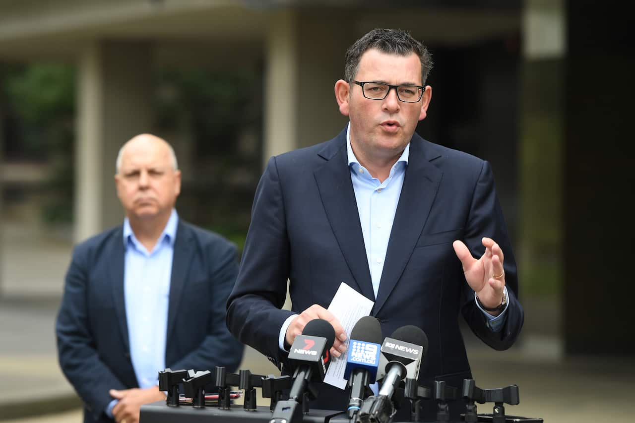 Victorian Premier Daniel Andrews and Victorian Treasurer Tim Pallas speak to the media during a press conference in Melbourne, Saturday, March 21, 2020. (AAP Image/Erik Anderson) NO ARCHIVING