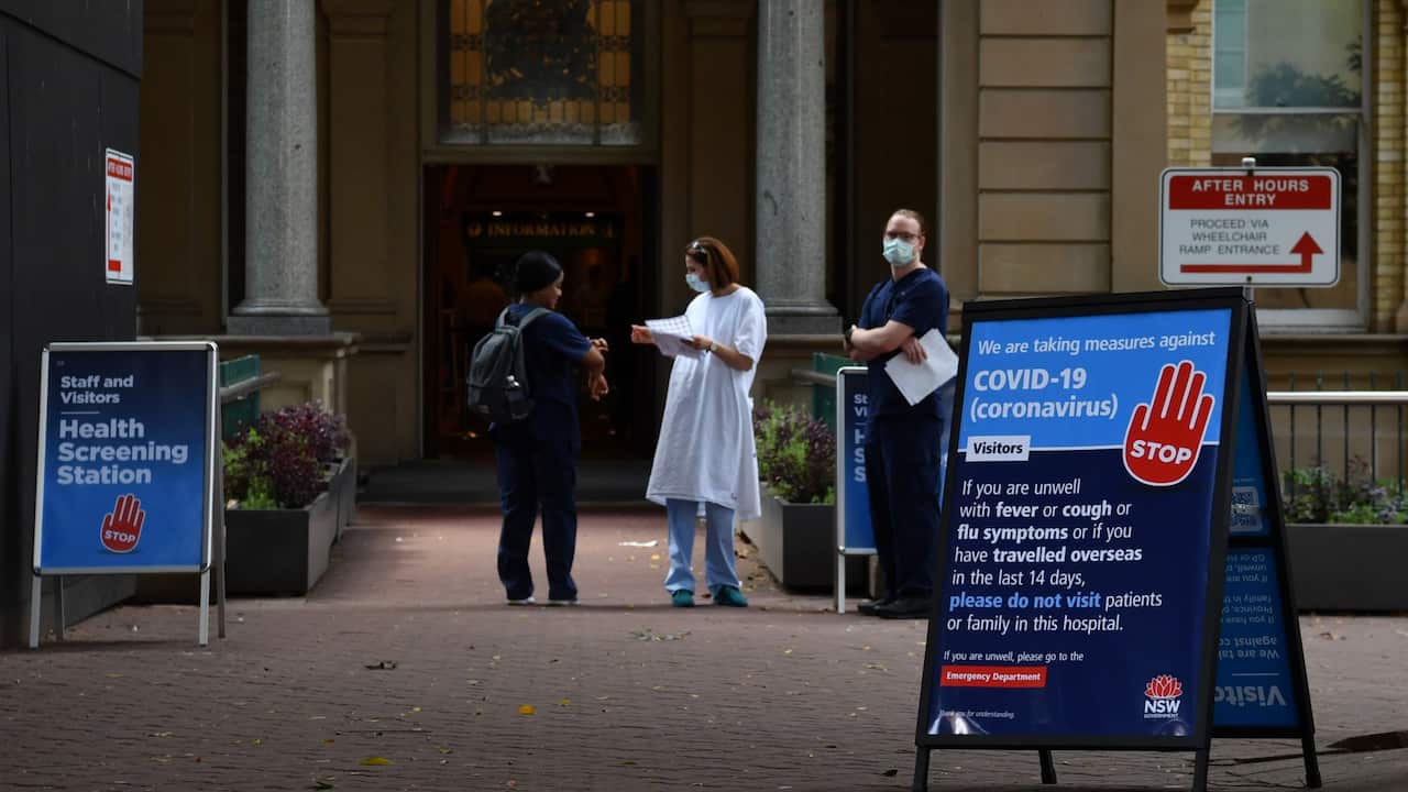 Staff wearing face masks outside the Royal Prince Alfred Hospital (RPA) in Camperdown, Sydney, Wednesday, March 25, 2020.