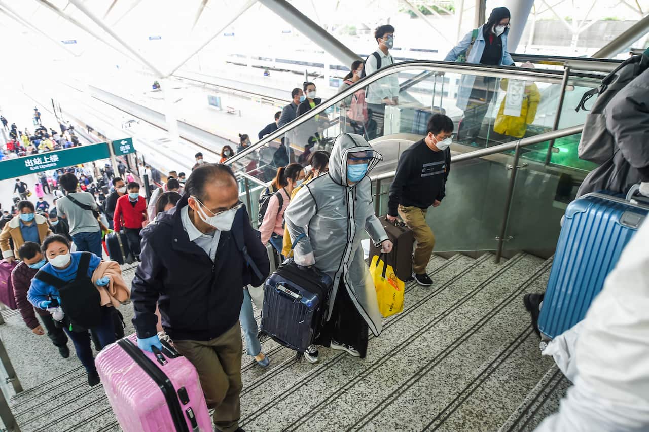 Passengers walk on the platform after getting off from a high-speed train traveling from Wuhan city to North Shenzhen Station in Shenzhen city, south China's Guangdong province, 8 April 2020...288 passengers traveled from Wuhan to North Shenzhen Station b