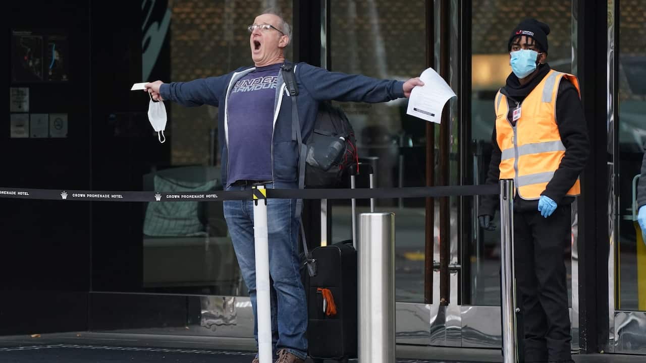A man reacts as he leaves the Crown Promenade Hotel after spending two weeks in forced quarantine in Melbourne, Sunday, April 12, 2020.