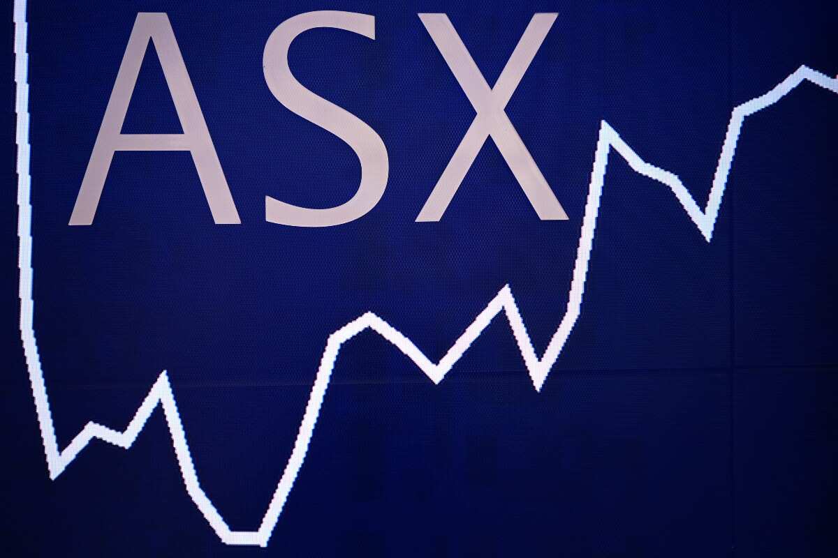 A double exposure showing market boards at the Australian Stock Exchange (ASX) in Sydney. 