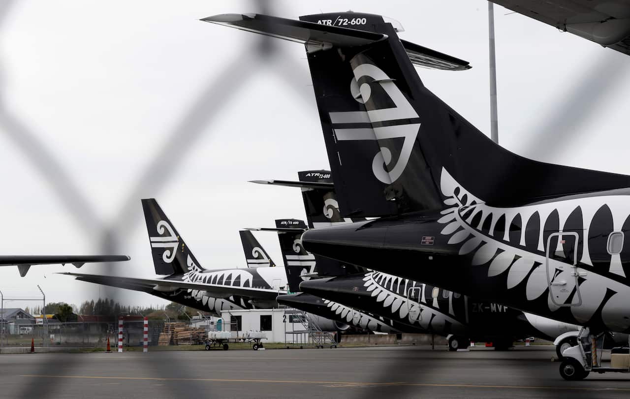 In this April 6, 2020 photo, Air New Zealand planes sit idle on the tarmac at Christchurch Airport, New Zealand.