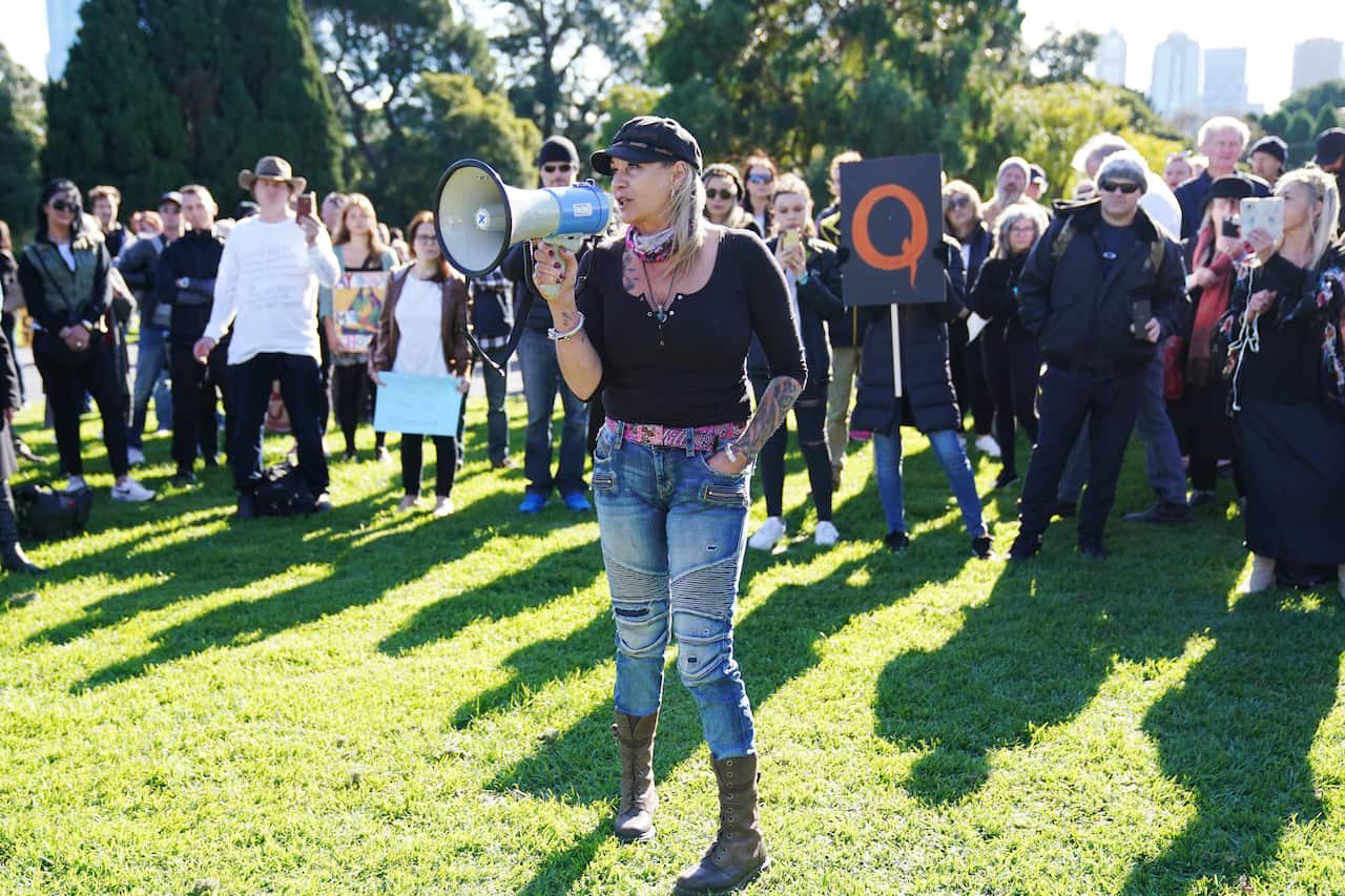 People protest during the 'Wake Up Australia!' march against mandatory vaccinations at the Botanical Gardens in Melbourne, Saturday, May 30, 2020. 