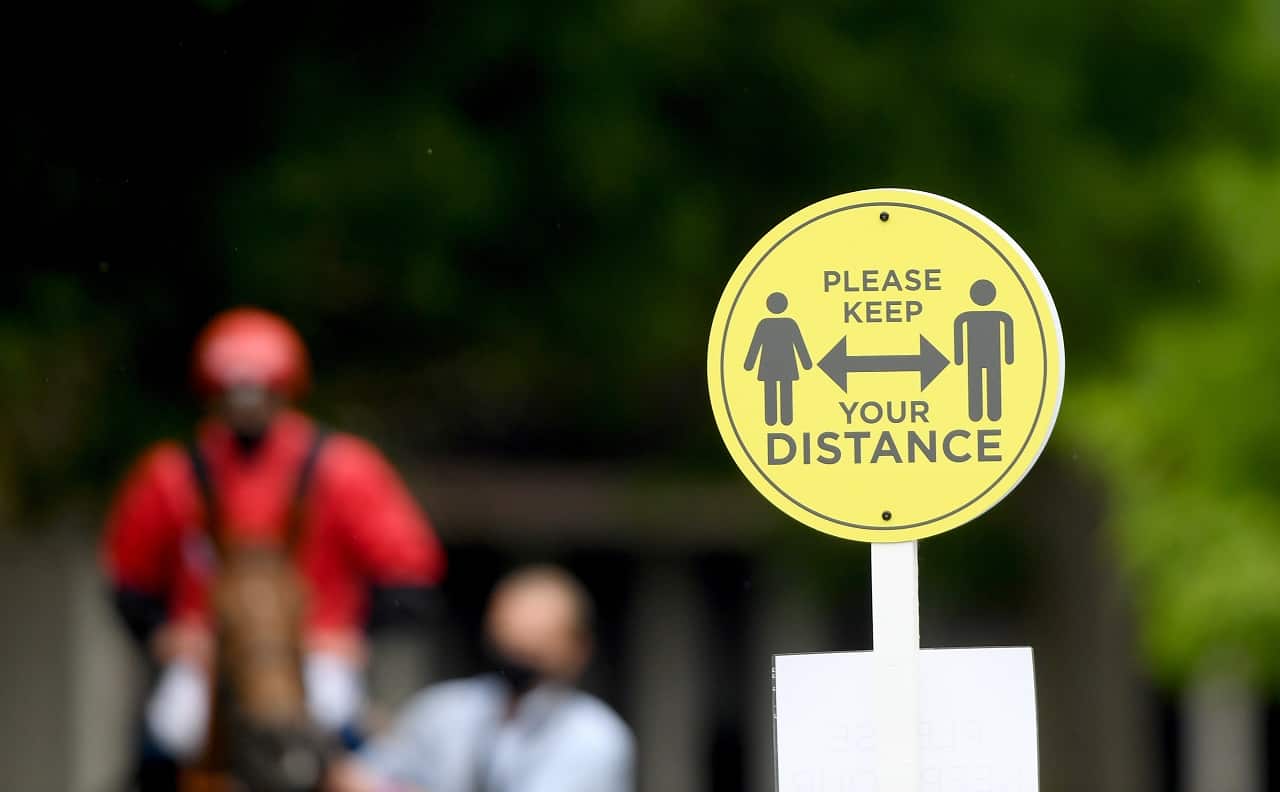 Social distancing signage at Kempton Racecourse.