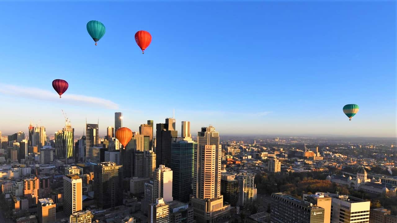 Hot air balloons are seen over Melbourne in early June when Victoria had recorded no zero cases. 