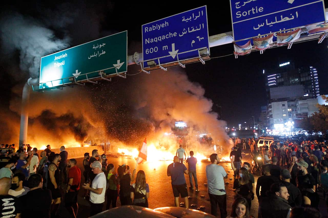 Anti-government protesters burn tires as they block the highway during a protest in Antelias area north of Beirut, Lebanon, 11 June 2020.  EPA/WAEL HAMZEH