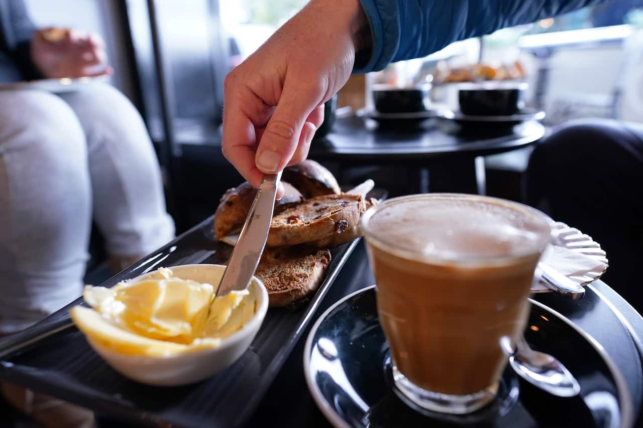 Patrons are seen having coffee at Flavours Patisserie Cafe in Parkdale, 
