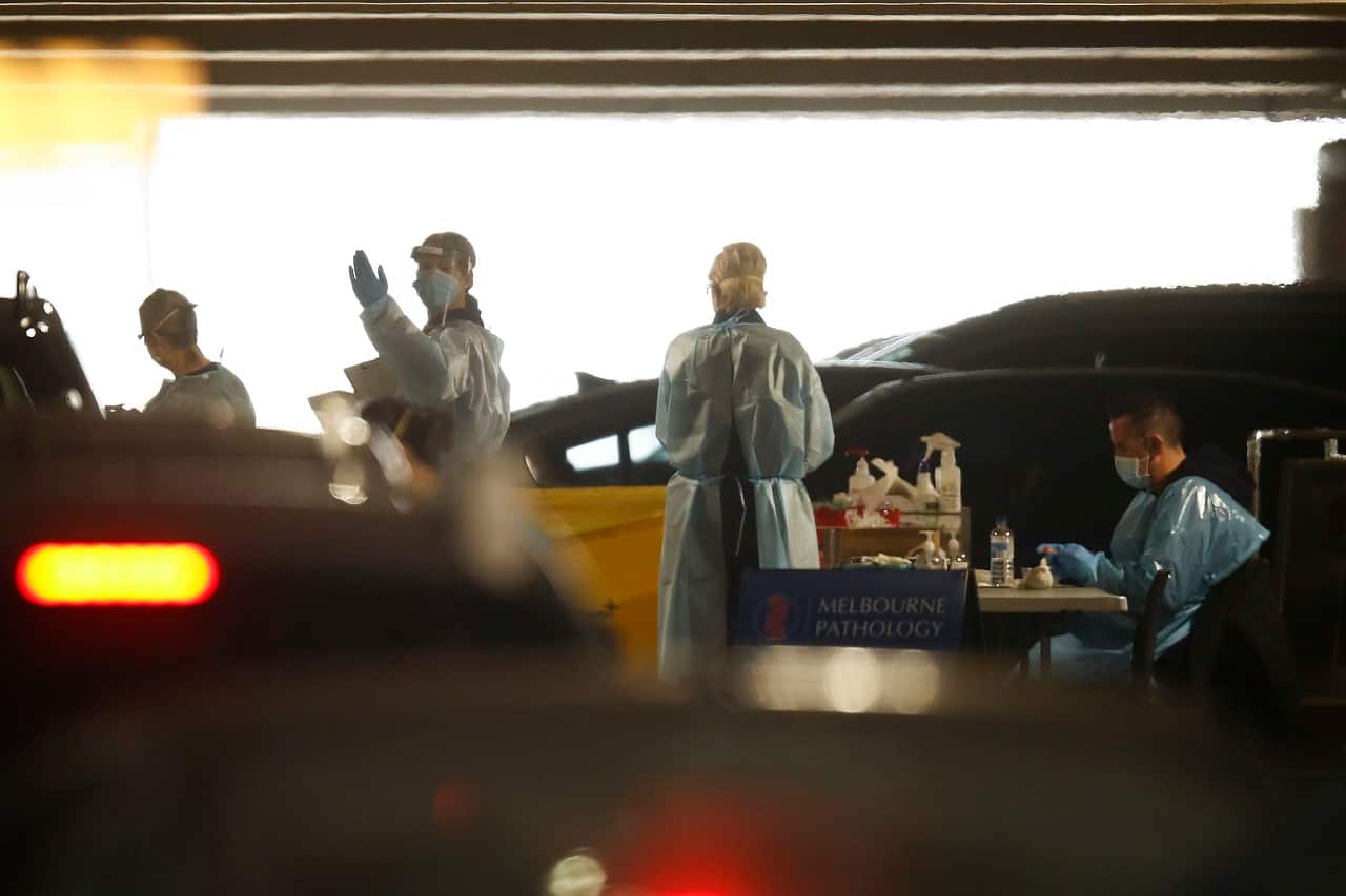 People queue up for COVID-19 testing at a pop-up testing site in Chadstone, Melbourne, Thursday, June 25, 2020.