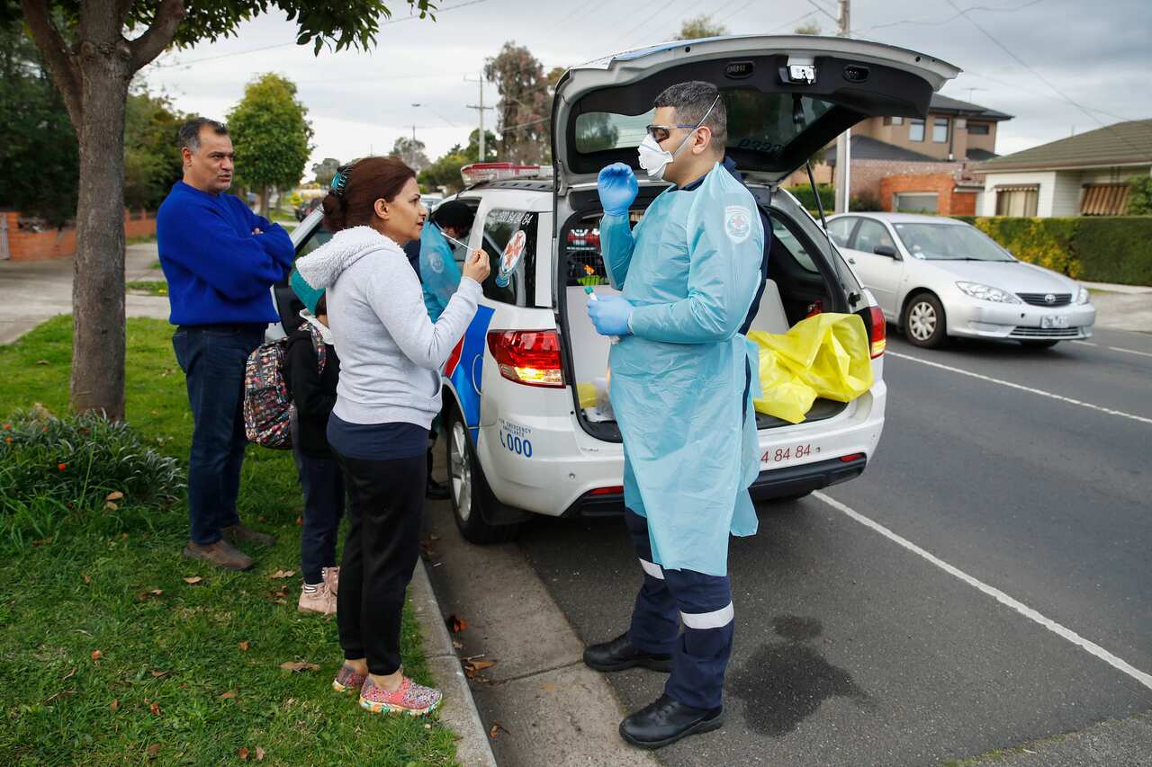 Paramedics perform COVID19 tests in Broadmeadows after Victoria State Government Health and Human Services people knock on doors