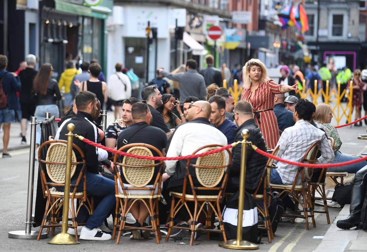 People eat and drink in bars and restaurants on an evening in Soho, London, Britain, 05 July 2020.
