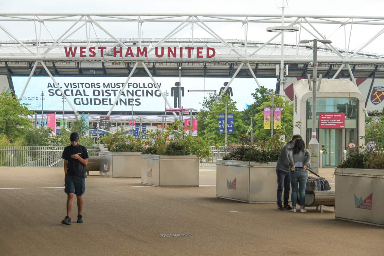 View of the West Ham United football stadium at the Queen Elizabeth Park informing all visitors to follow social distancing guidelines.