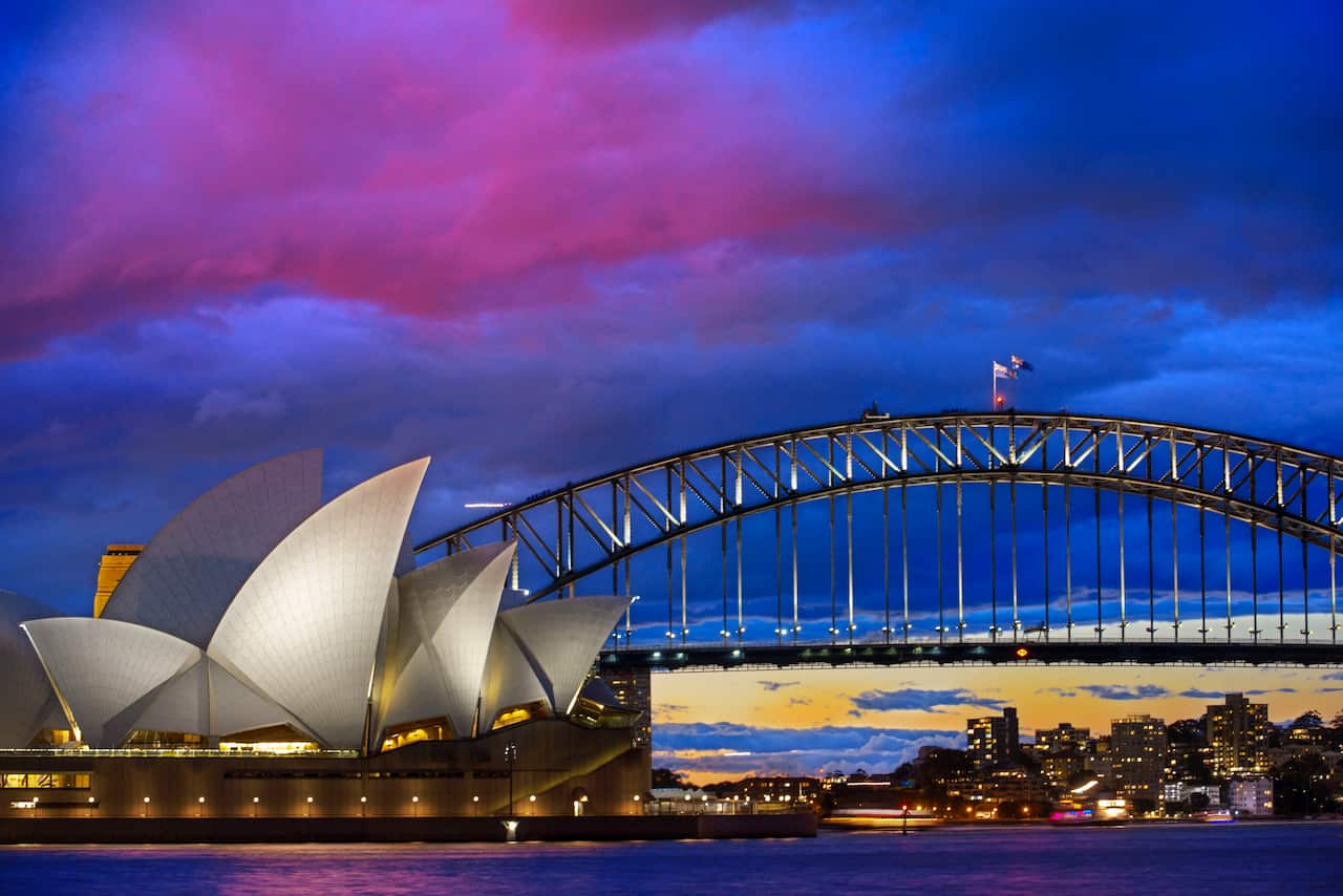 February 2020  - World famous Sydney Opera House and Harbour bridge at sunset. Blurred clouds and lights of landmarks reflect in blurred waters of Harbour. Sydney, New South Wales, Australia (Photo by Sergi Reboredo/Sipa USA)