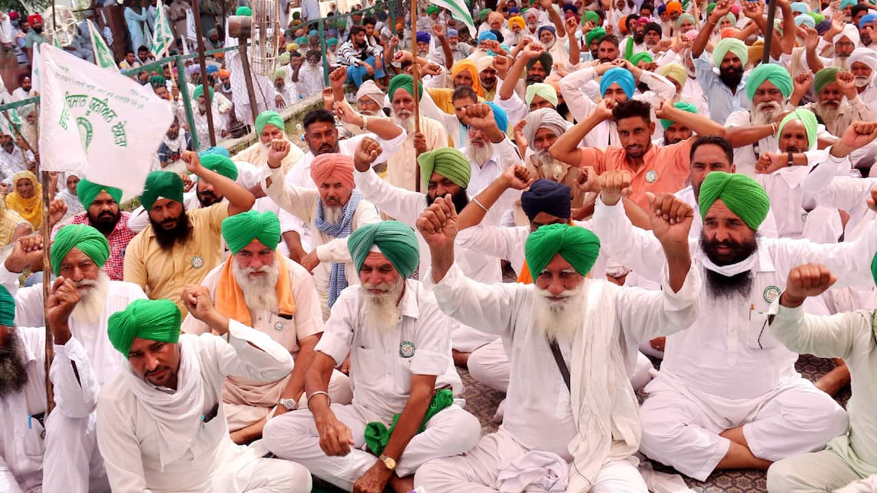 What has sparked the massive farmers protest in India amidst the coronavirus pandemic?