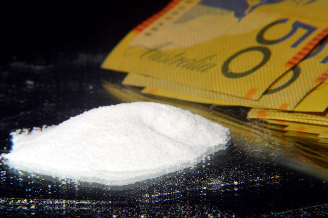 ADDITIONAL RATES MAY APPLY FOR USE OF IMAGE. Melbourne, June 2003. Illegal drugs and a roll of Australian fifty dollar ($50) notes. (AAP Image/David Ewing) NO ARCHIVING