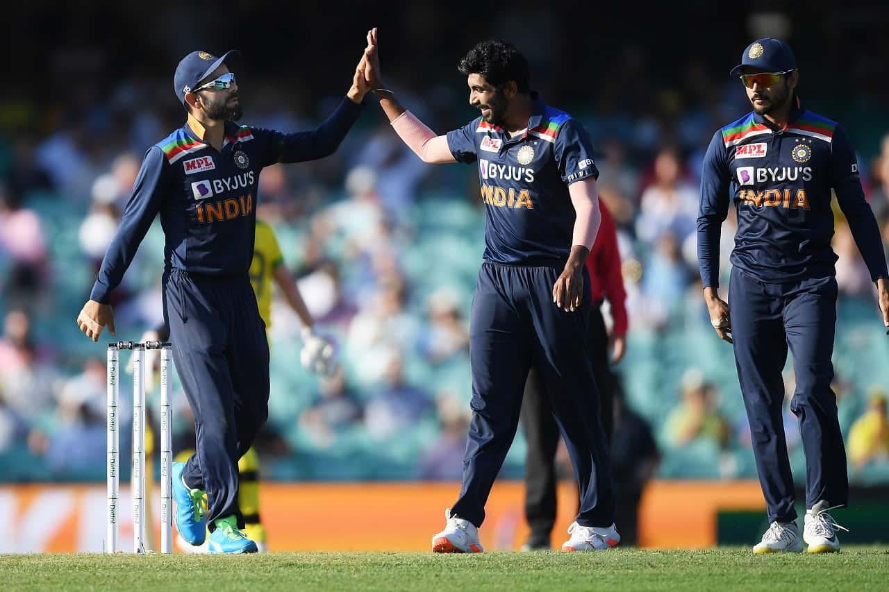 Virat Kohli congratulates Jasprit Bumrah of India for taking the wicket of Aaron Finch at the SCG in Sydney, Friday, November 27, 2020.