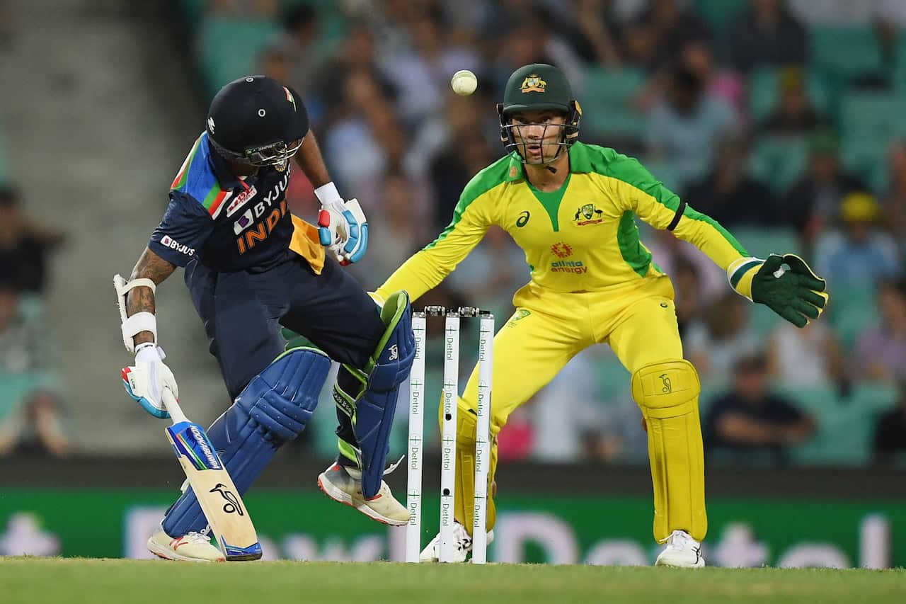 Shikhar Dhawan of India tries to stop the ball with his foot from hitting the wickets during the first ODI cricket match between Australia and India at the SCG in Sydney, Friday, November 27, 2020.