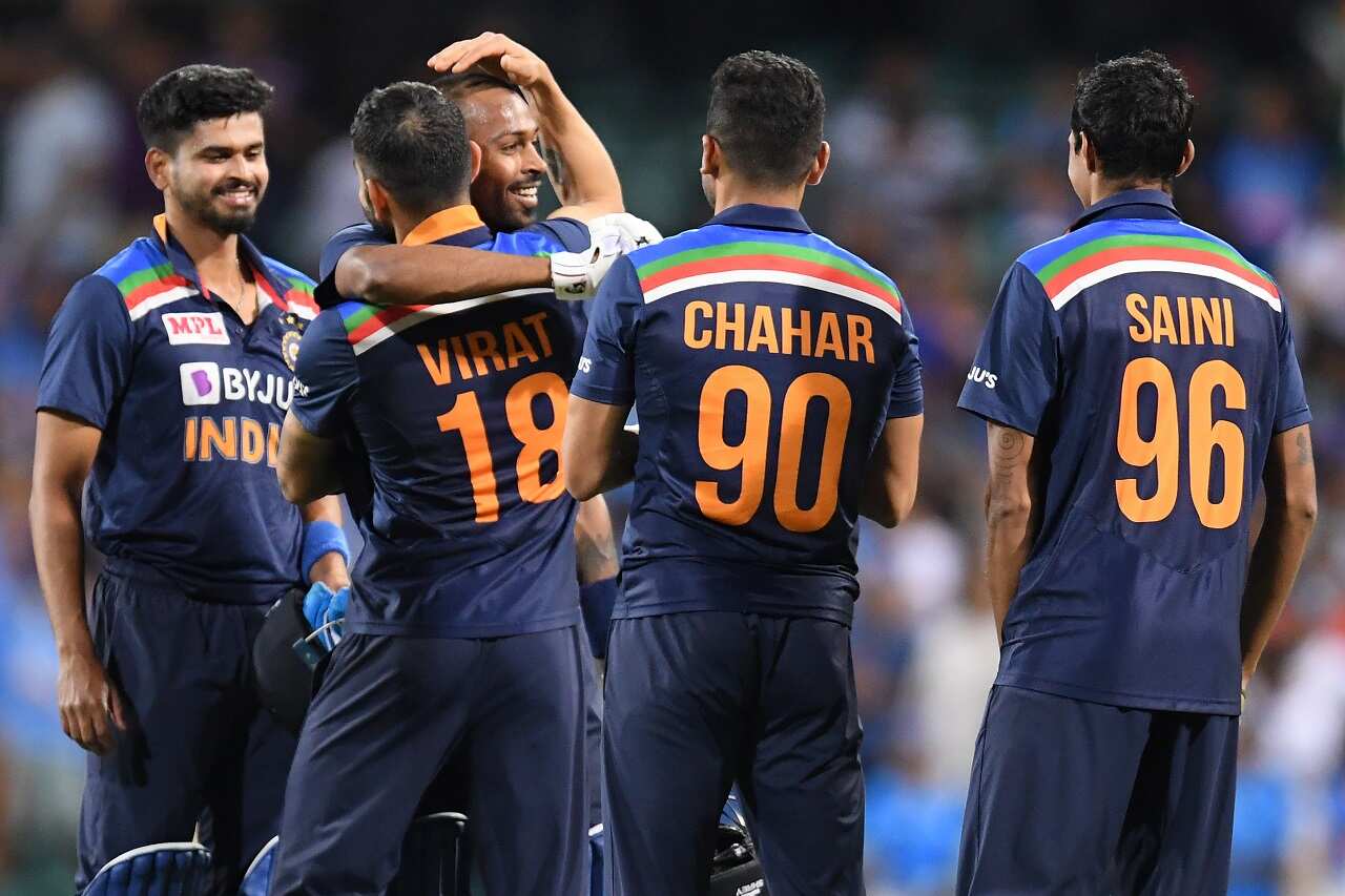 Virat Kohli of India congratulates batsmen Shreyas Iyer ands Hardik Pandya following their win over Australia at the SCG, Sydney, Sunday, December 6, 2020.