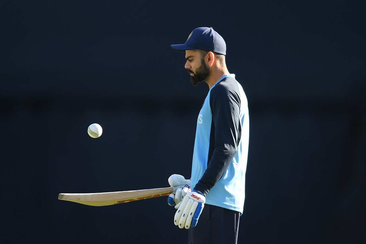 Virat Kohli of India warms up ahead of play in the third T20 cricket match between Australia and India at the SCG, Sydney, Tuesday, December 8, 2020.
