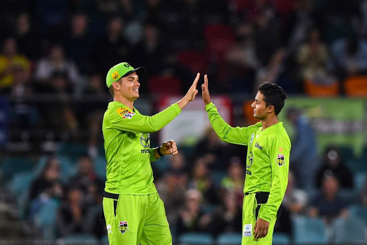 Tanveer Sangha celebrates after winning the BBL match between the Sydney Thunder and Melbourne Renegades at Manuka Oval, Canberra, Saturday, Dec 26, 2020.