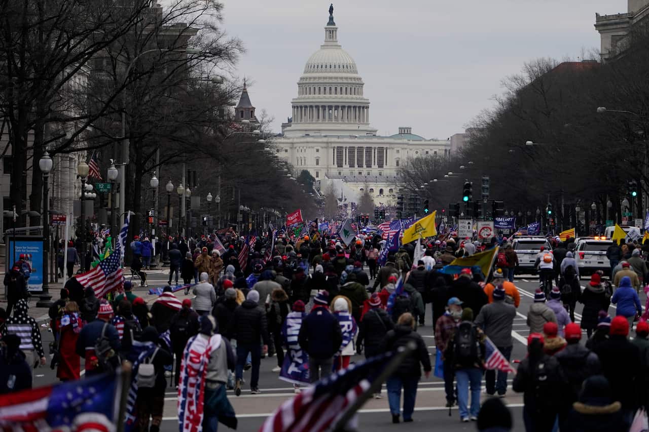 Supporters of President Donald Trump march on Pennsylvania Avenue towards the U.S. Capitol, Wednesday, Jan. 6, 2021, in Washington. (AP Photo/Jacquelyn Martin)