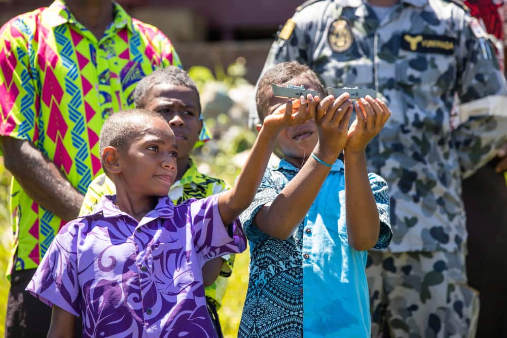 Royal Australian Navy Nursing Officer Lieutenant Commander Roneeel Chandra prepares to treat a patient onboard HMAS Adelaide during Exercise Sea Wader.