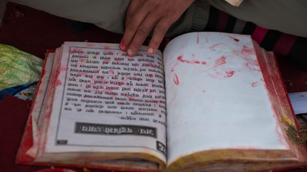 Nepali Hindu priest recites the holy book Swasthani during the Swasthani Brata Katha festival. 