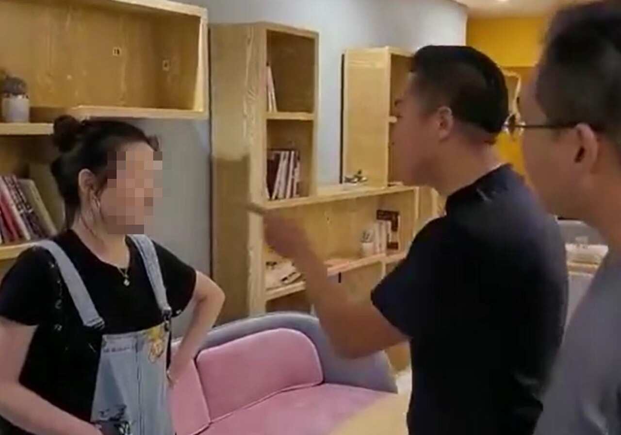 In the video, a young worker is slapped across the face then kicked in the stomach after an argument broke out.