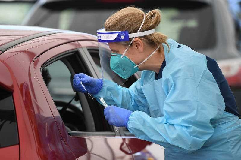 Health workers conduct coronavirus testing at a Covid-19 facility at Bondi Beach in Sydney