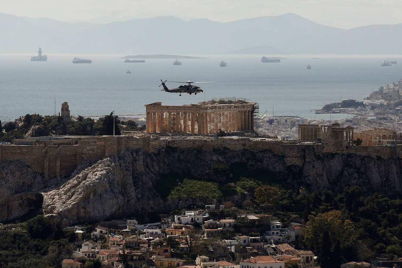 Greek military helicopter over Acropolis ahead of Greece's Indepence Day celebrations, 25th March 2021.