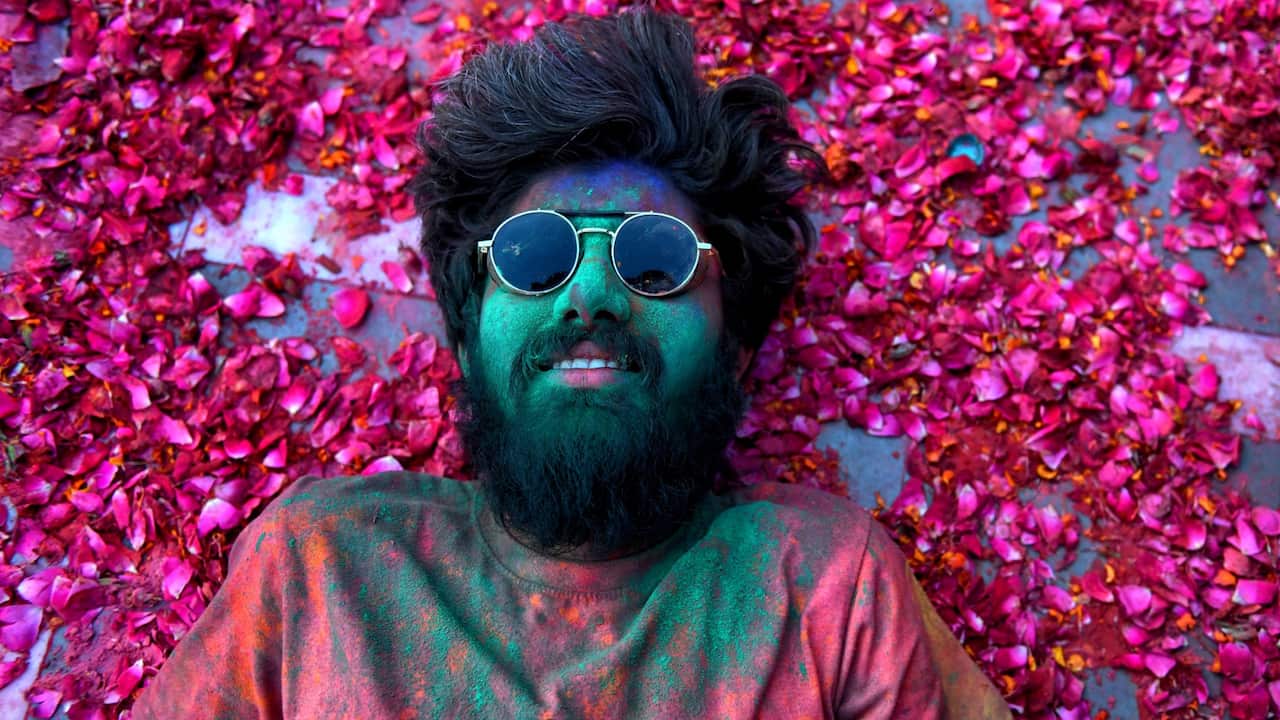 Holi celebration often involves flowers apart from colour powders and water  