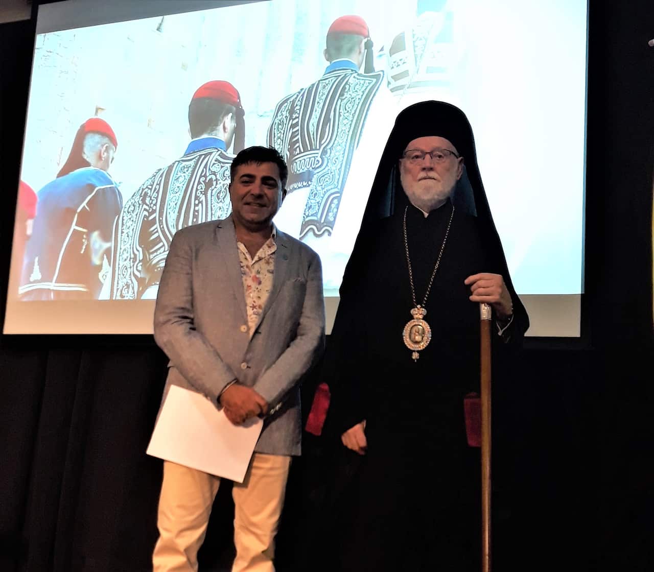 Greek Australian photographer Nick Bourdaniotis and Bishop Ezekiel.