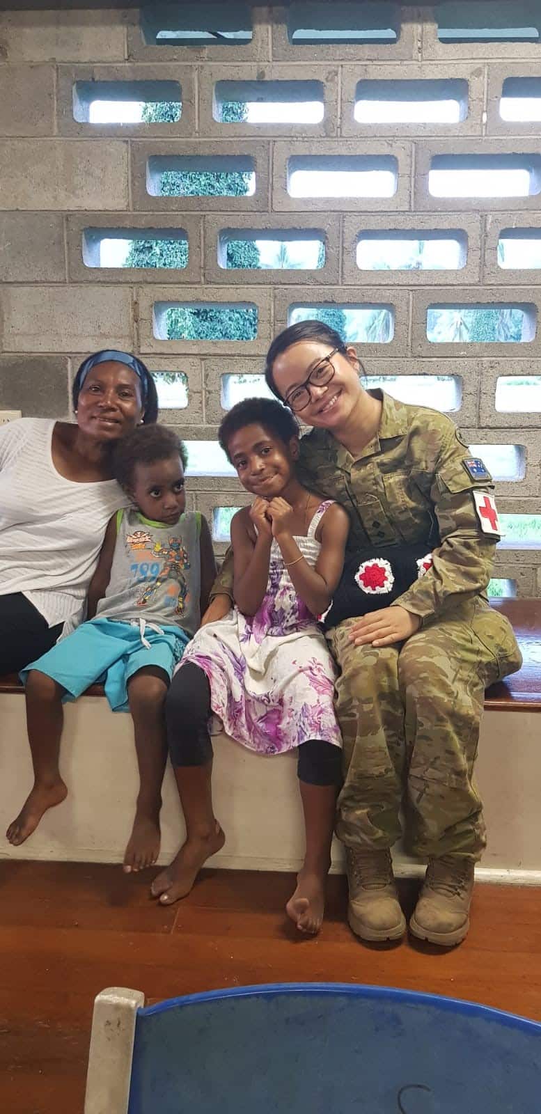  Exercise Puk Puk: Australian Army Physiotherapist Captain (then Lieutenant) Xiaobei Ye meets with local people from the Lae area in 2019 while deployed on Exercise Puk Puk in Papua New Guinea.
