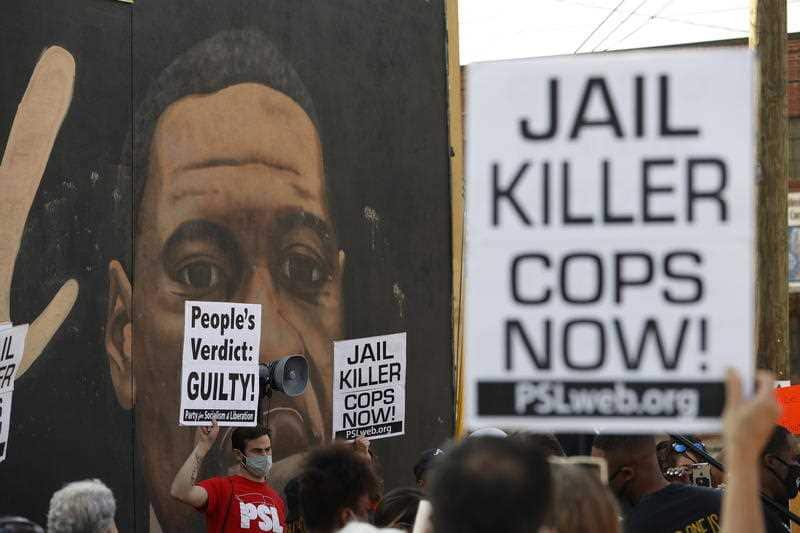 People react near a mural of George Floyd after former Minneapolis Police Department Police Officer Derek Chauvin was found guilty on all counts in Minneapolis, Minnesota in the death of Floyd in Atlanta, Georgia USA, 20 April 2021.
