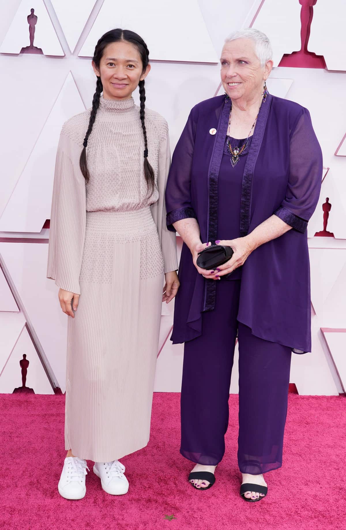 Chloe Zhao (L) and Charlene Swankie arrive for the 93rd annual Academy Awards ceremony