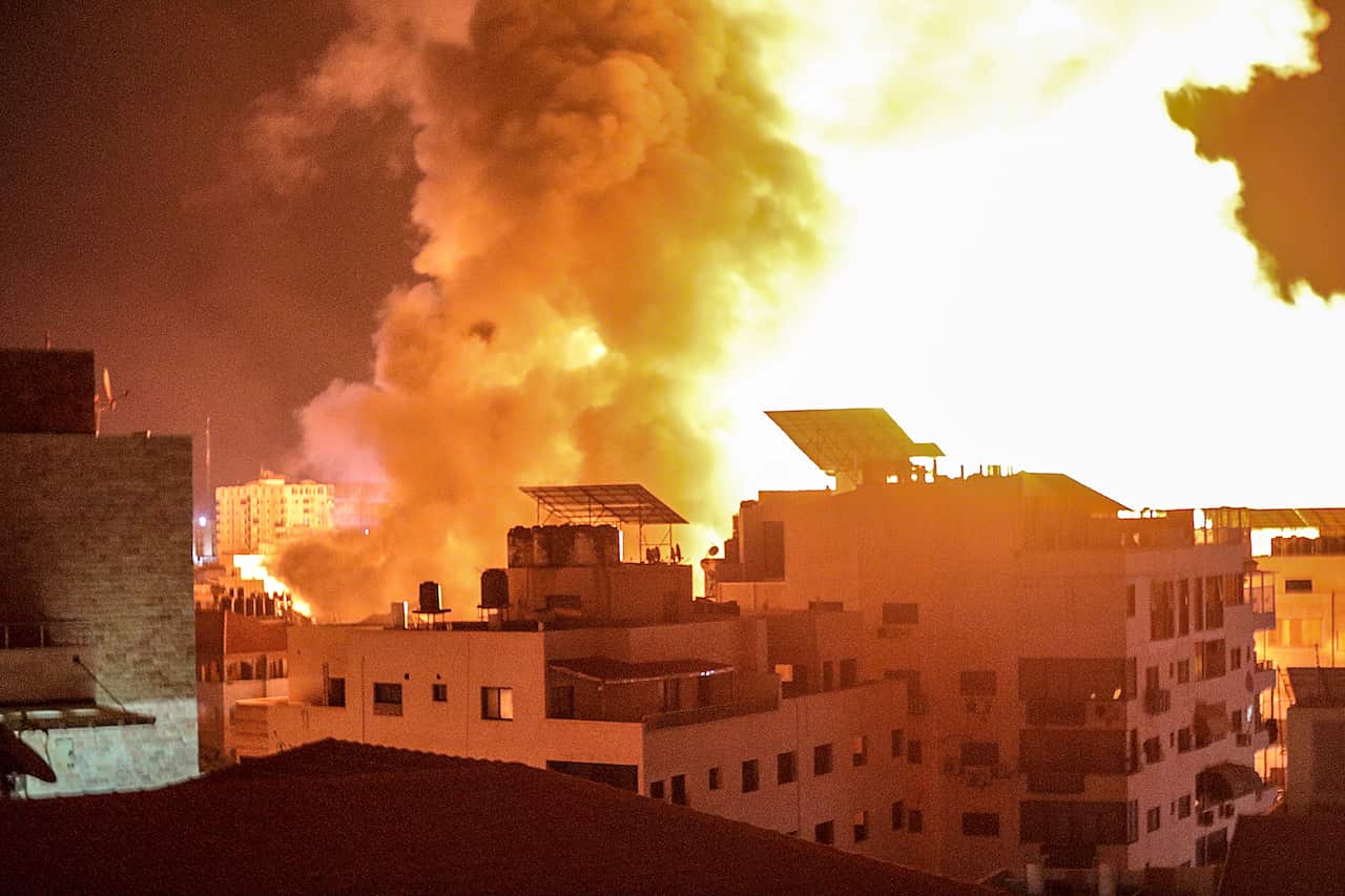 Smoke and flames rise following an Israeli air strike on Gaza City