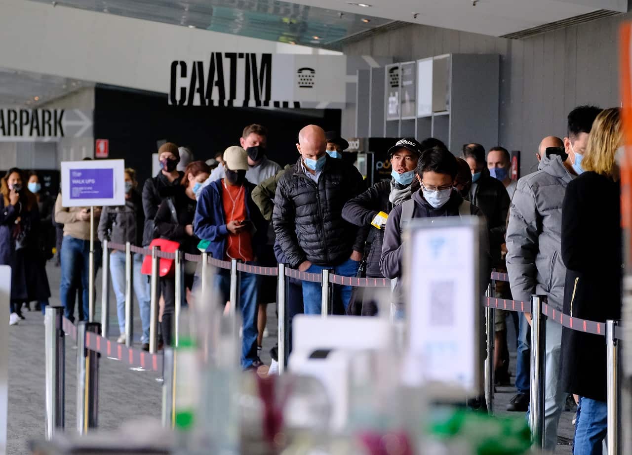 People line up to be vaccinated at a mass coronavirus vaccination hub at the Melbourne Convention and Exhibition Centre in Melbourne, Friday, May 28, 2021.