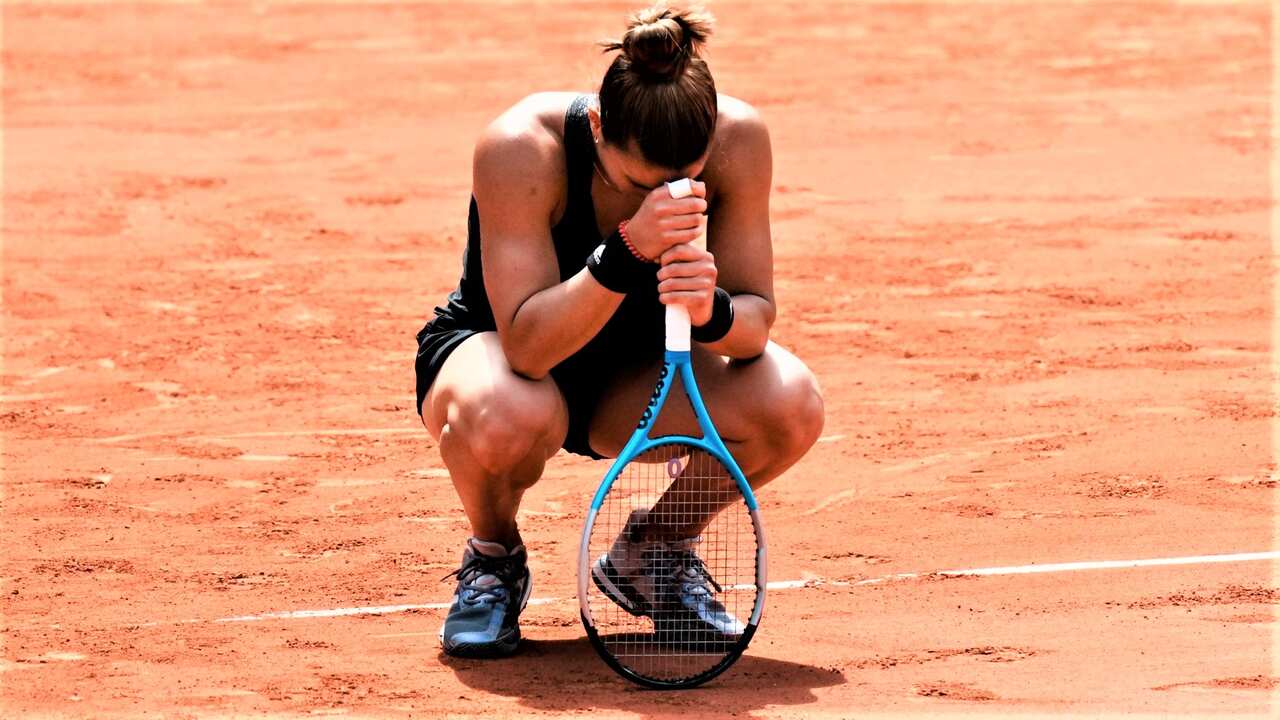 Maria Sakkari of Greece reacts as she defeats Poland's Iga Swiątek during their quarterfinal match of the French Open tennis tournament at the Roland Garros. 