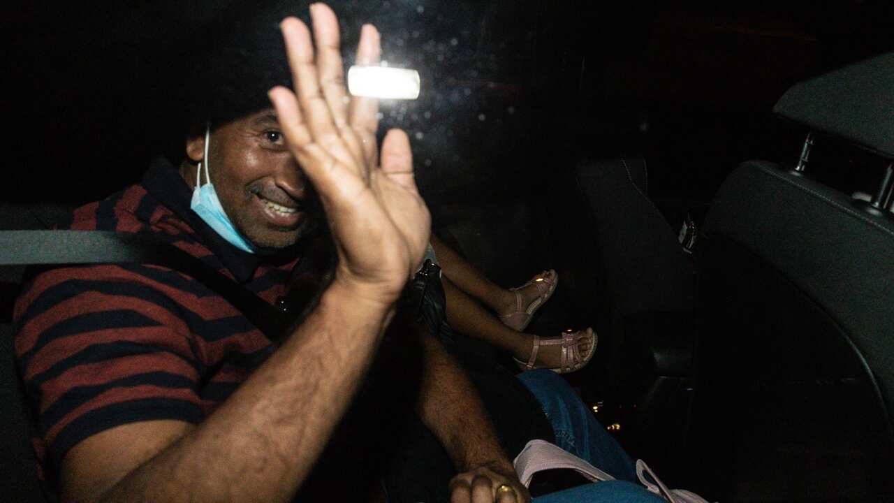 Nades Murugappan and his Australian-born daughter Kopika (6) leave Perth airport after arriving on a charter flight from Christmas Island in Perth, Tuesday, June 15, 2021