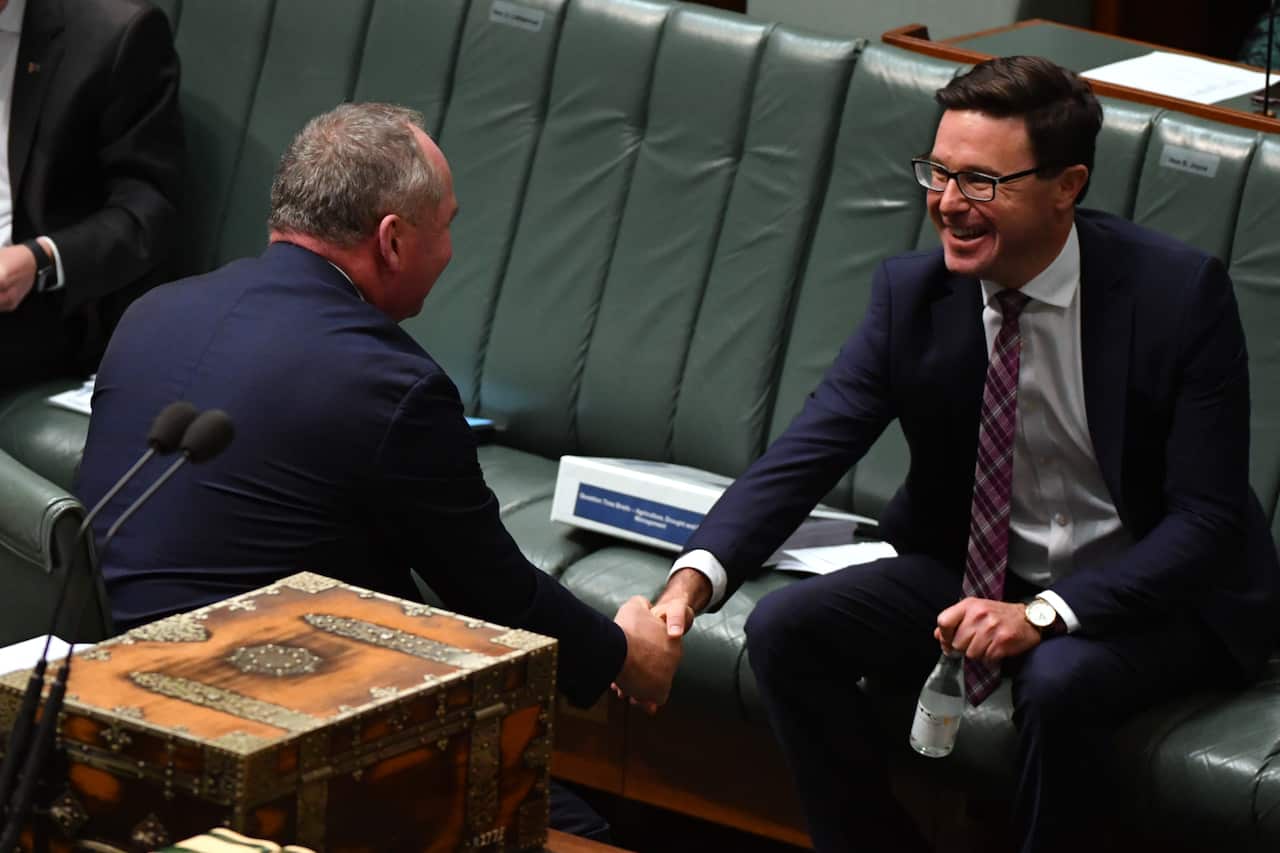 Minister for Agriculture David Littleproud (R) congratulates Deputy Prime Minister Barnaby Joyce during Question Time in the House of Representatives at Parliament House in Canberra, Tuesday, June 22, 2021. (AAP Image/Mick Tsikas) NO ARCHIVING